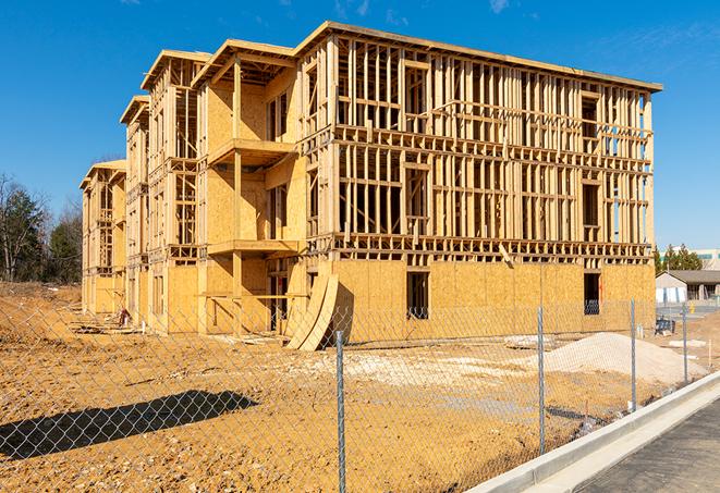 construction zone secured with a temporary fence, marked with warning signs in Moreno Valley